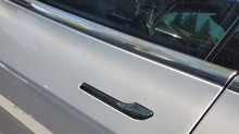 Tesla under investigation over door handles that can lock passengers in cars