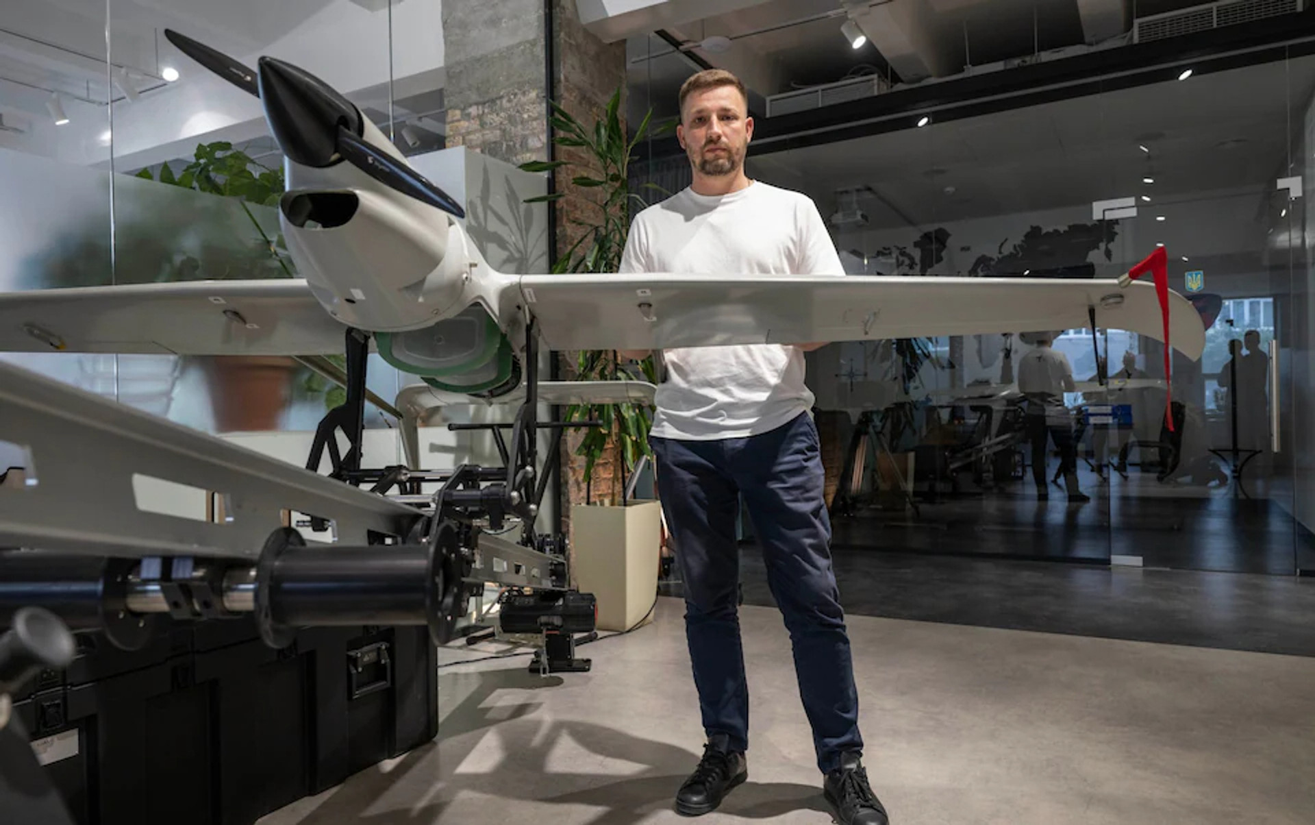 Skyeton CEO Roman Knyazhenko near his own Raybird drone